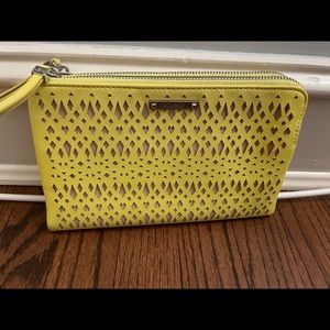 Stella and Dot yellow perforated leather clutch.